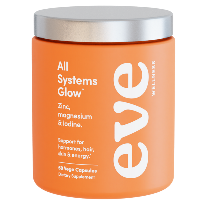 Orange supplement jar with silver lid labeled 'All Systems Glow' by Eve Wellness on a white background